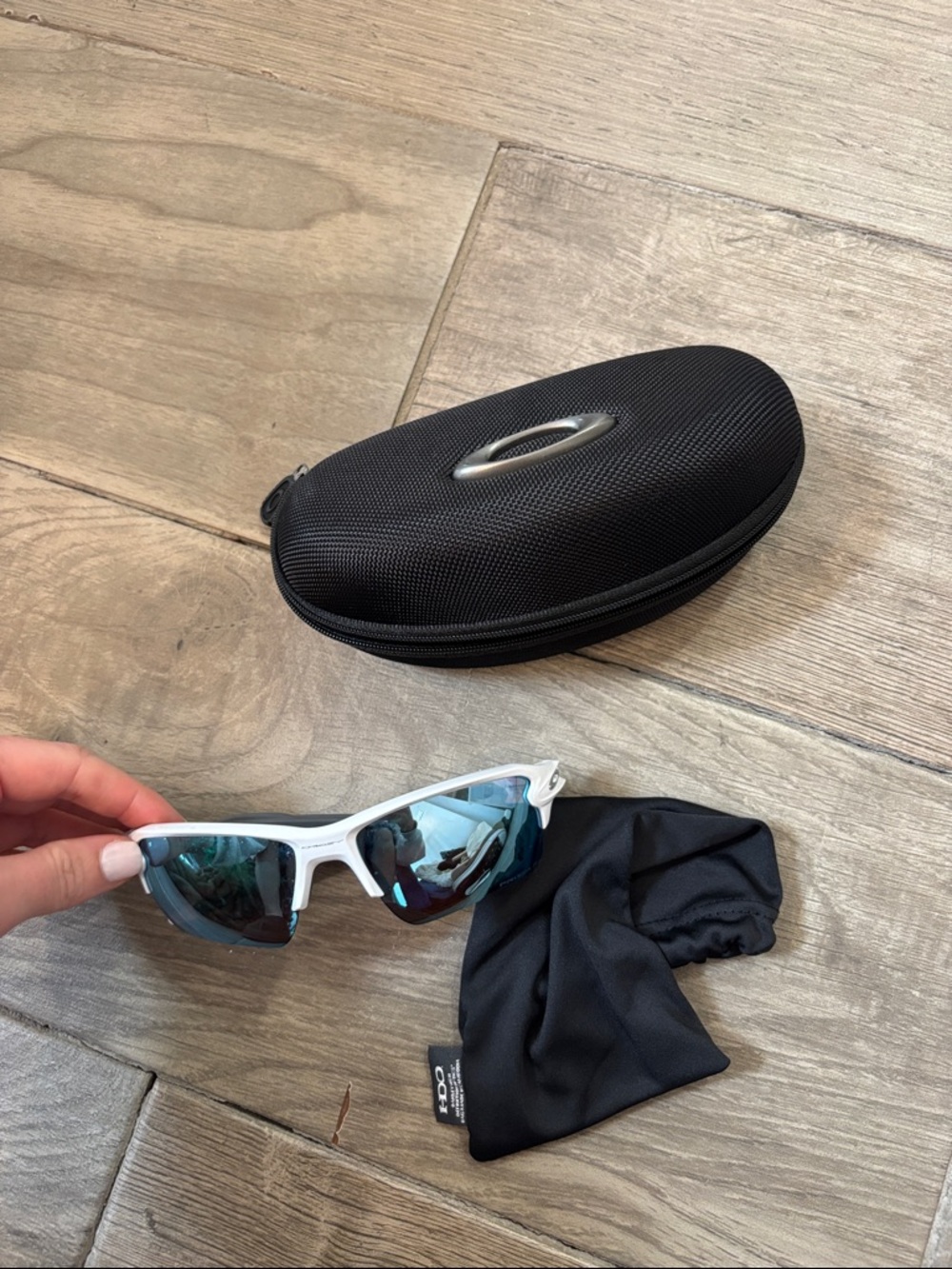 Oakley White Frame Sunglasses with Blue Mirrored Lenses